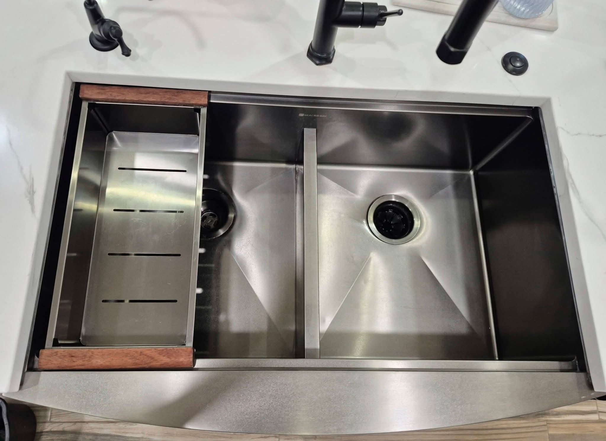 Sparkling stainless steel kitchen sink after professional deep cleaning