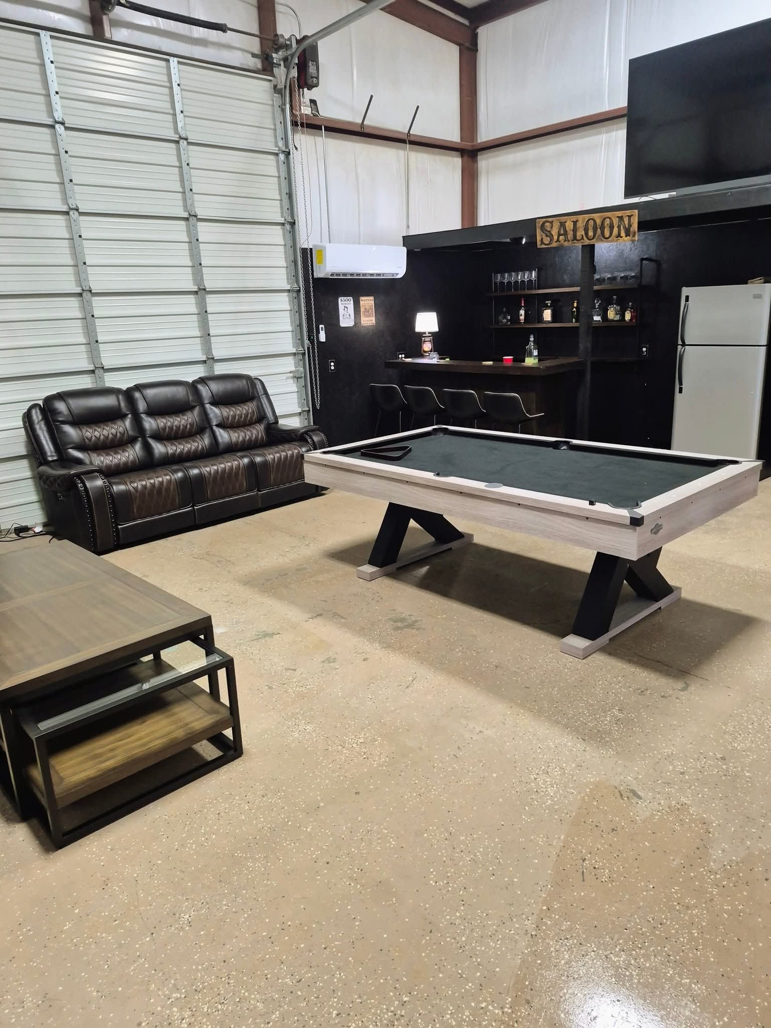 Large entertainment room with pool table and bar area cleaned by Redeemed Cleaning Services